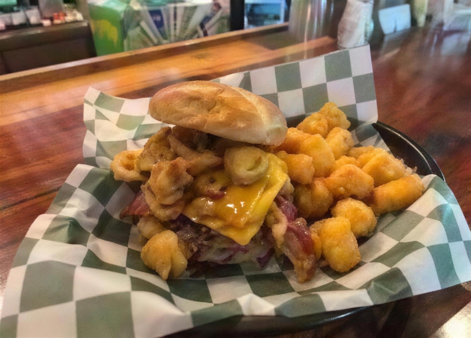 A made-to-order cheeseburger with cheese curds and tots at Papa B's