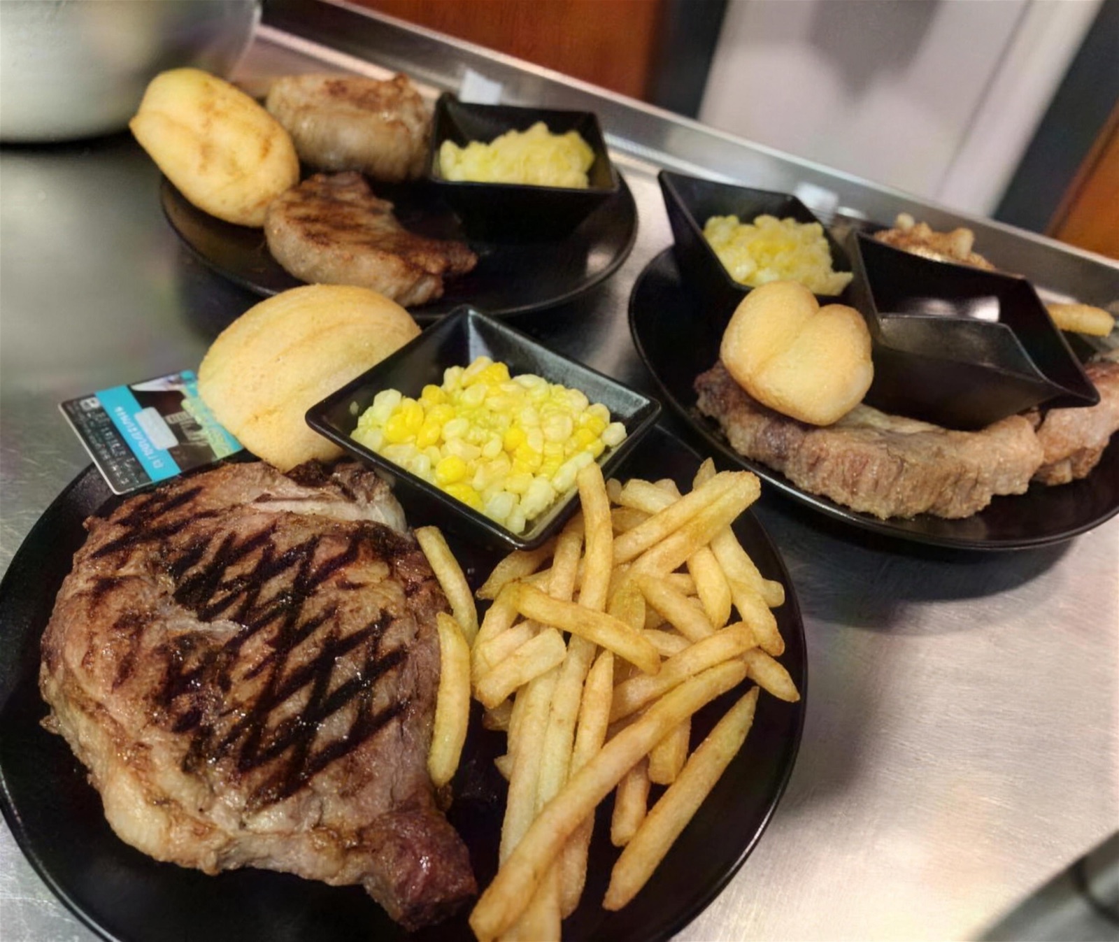 Grilled steak plates with fries at Papa B's